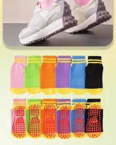 Detailed view of colorful non-slip trampoline socks with grip soles for indoor floor use.