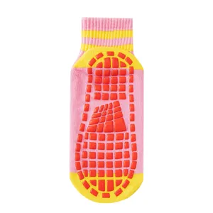 Kids anti-slip trampoline grip socks with bright colors for indoor floor yoga and fitness use.