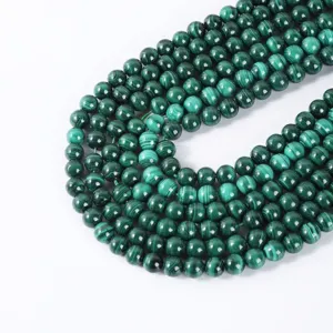 Polished dark green malachite round loose beads for DIY jewelry making and bracelets.