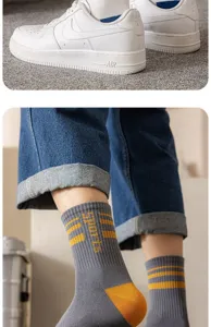 Men's mid-tube cotton socks with stylish stripes and sports text detail for daily wear.