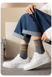 Grey ribbed crew socks detail view featuring yellow stripes and sports text for daily men