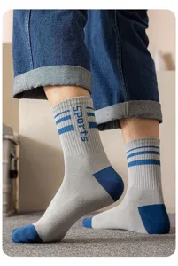 Men mid-calf athletic socks with blue heel toe and striped ribbed cuffs for daily running.