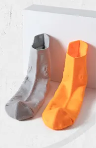 Detail shot of breathable athletic running socks with anti-slip knit texture for fitness.