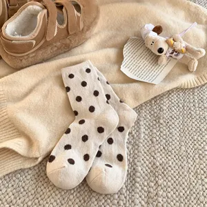 Women winter warm polka dot mid-tube socks, cute brown and beige knitted casual hosiery.