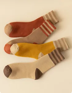 Detailed close-up of thick thermal winter striped mid-tube socks with soft loop texture.