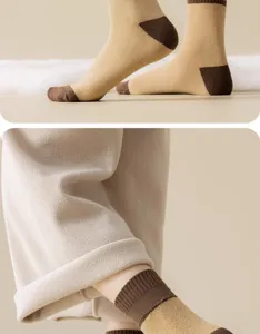 Close-up detail of women's thick thermal loop socks in beige and brown contrast design.