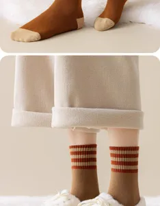 Close-up detail of women's thick winter thermal striped loop socks in brown and beige.