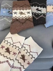 Thick winter mid-calf socks with Fair Isle vintage dog and bow patterns, cozy for boots.