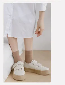 Brown cotton mid-tube socks detail shot, soft daily casual wear for women early autumn.