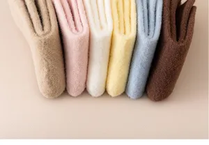 Detailed view of cozy winter fleece socks for girls, soft coral fleece in multiple colors.