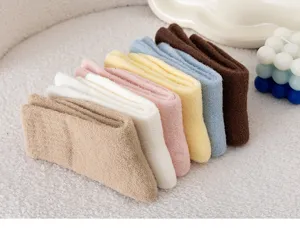 Close-up of cozy children's thick fleece warm socks detail view in various soft winter colors.