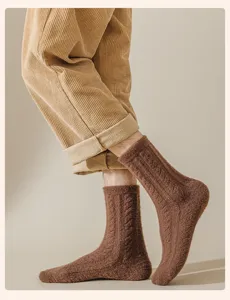 Detailed shot of brown thick knit thermal wool socks for men winter warmth cozy casual wear.