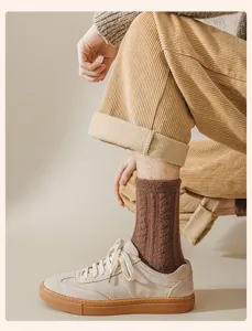 Detailed shot of men's brown ribbed wool thermal socks styled with corduroy pants.
