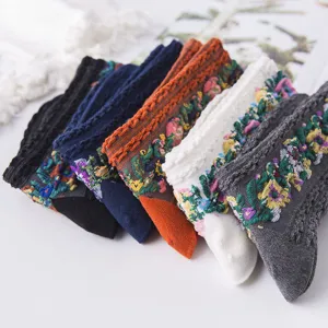 Vintage floral jacquard mid-calf socks detailed close-up view, colorful stacked design.