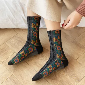 Detail view of retro floral jacquard mid-tube socks, cozy knit texture for autumn and winter.