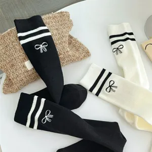 Women's JK college style long tube socks with double stripes and cute bow embroidery.