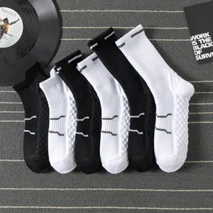 Detailed view of men's athletic crew socks with thick towel bottom and breathable mesh weave.