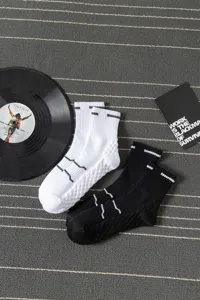 Men's mid-calf athletic sports socks featuring towel bottom comfort, shown in detail view.