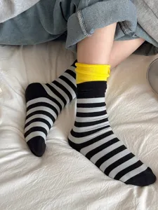 Detail shot of dopamine colorblock striped slouch socks with rolled cuff, soft fabric.