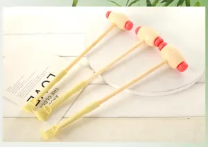Wooden handle massage hammer and back scratcher dual-use relaxation tool for daily body care.