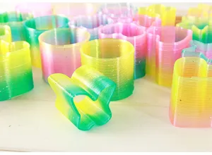Colorful rainbow spring toys set, plastic magical spring stretchy toys in various shapes.