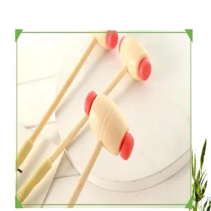 Detail view of the wooden manual massage hammer with red ends for back beating and relaxation.