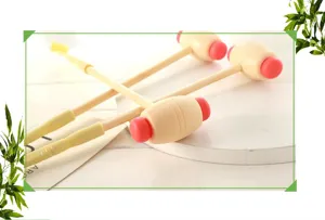 Wooden handle plastic massage hammer and back scratcher tool for relaxing daily body massage.