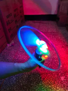 LED flashing pull string flying saucer toy, night market glowing bamboo dragonfly detail.