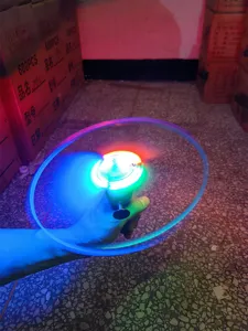LED glowing pull string flying saucer toy, flashing bamboo dragonfly hand spinner disc detail.
