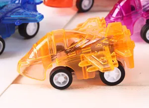 Transparent mini pull back fighter jet toy detail, colorful plastic aircraft model closeup.