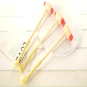 Wooden handle plastic massage hammer and dual-head back scratcher for body relaxation.