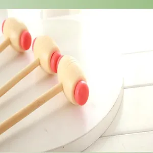 Manual wooden handle massage hammer, compact tapping tool for back relief and body relaxation.