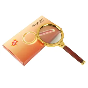 Handlupe 70mm mit goldenem Metallrahmen und Holzmaserung-Griff zum Lesen und Betrachten.
