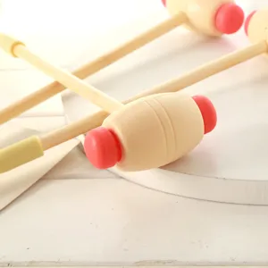 Wooden handle plastic massage hammer for back relaxation and body relief daily use.