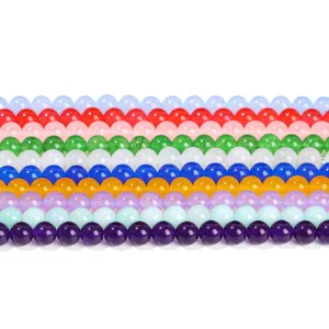 Rows of colorful round chalcedony jade beads for DIY jewelry making and bracelet crafts