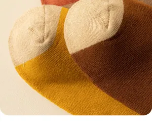 Thickened thermal women terry socks detail, cozy winter warm knit long socks close up.
