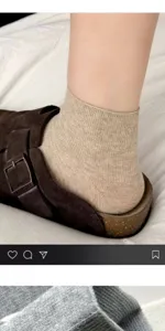 Close-up detail of beige ribbed women's short socks, breathable knit ankle sock texture.