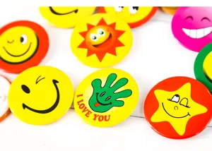 Colorful smiley face metal badges, cute cartoon pin buttons wholesale, various designs.