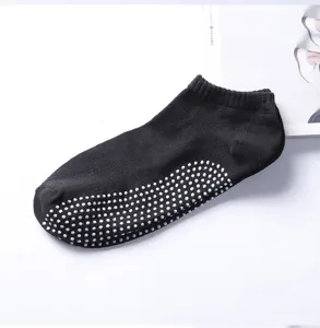 Black non-slip yoga socks for men, featuring silicone grip dots on sole for fitness and home use.