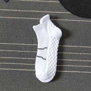 White athletic ankle socks for men, featuring a cushioned towel bottom and breathable knit.