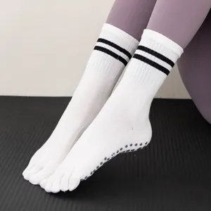 White five-toe yoga socks with black stripes and non-slip grip dots for fitness running pilates