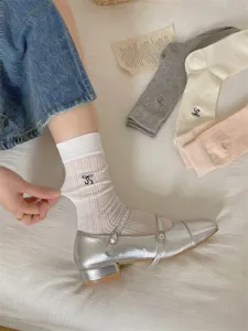 Summer thin mesh breathable mid-tube socks with cute bow embroidery and stylish design style.