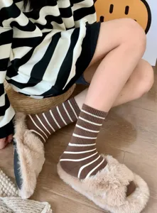Brown striped mid-calf socks for women, fashionable cozy autumn winter hosiery.