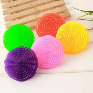 Detailed view of colorful silicone scalp massager and shampoo hair brushes for daily hair care.