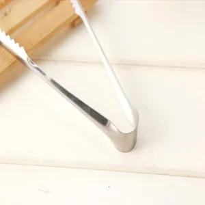 Stainless steel tong detail view, ideal for ice cubes, sugar or delicate pastry.