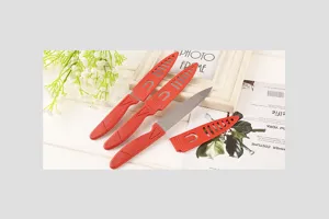 Red fruit knife set stainless steel kitchen peeling knives with protective sheaths detail view