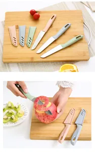 Nordic style stainless steel fruit knife set with protective sheath for kitchen use detail.