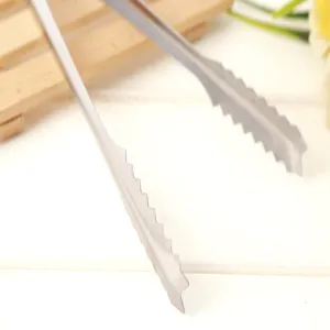 Stainless steel ice tong detail shot, serrated edge design for secure grip on food items.