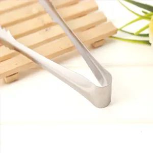 Stainless steel ice tong kitchen BBQ bread food clamp multi-functional bar tool for home use.