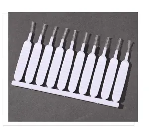 Mini cleaning brush set detail, plastic interdental brushes for small gaps and nozzles.
